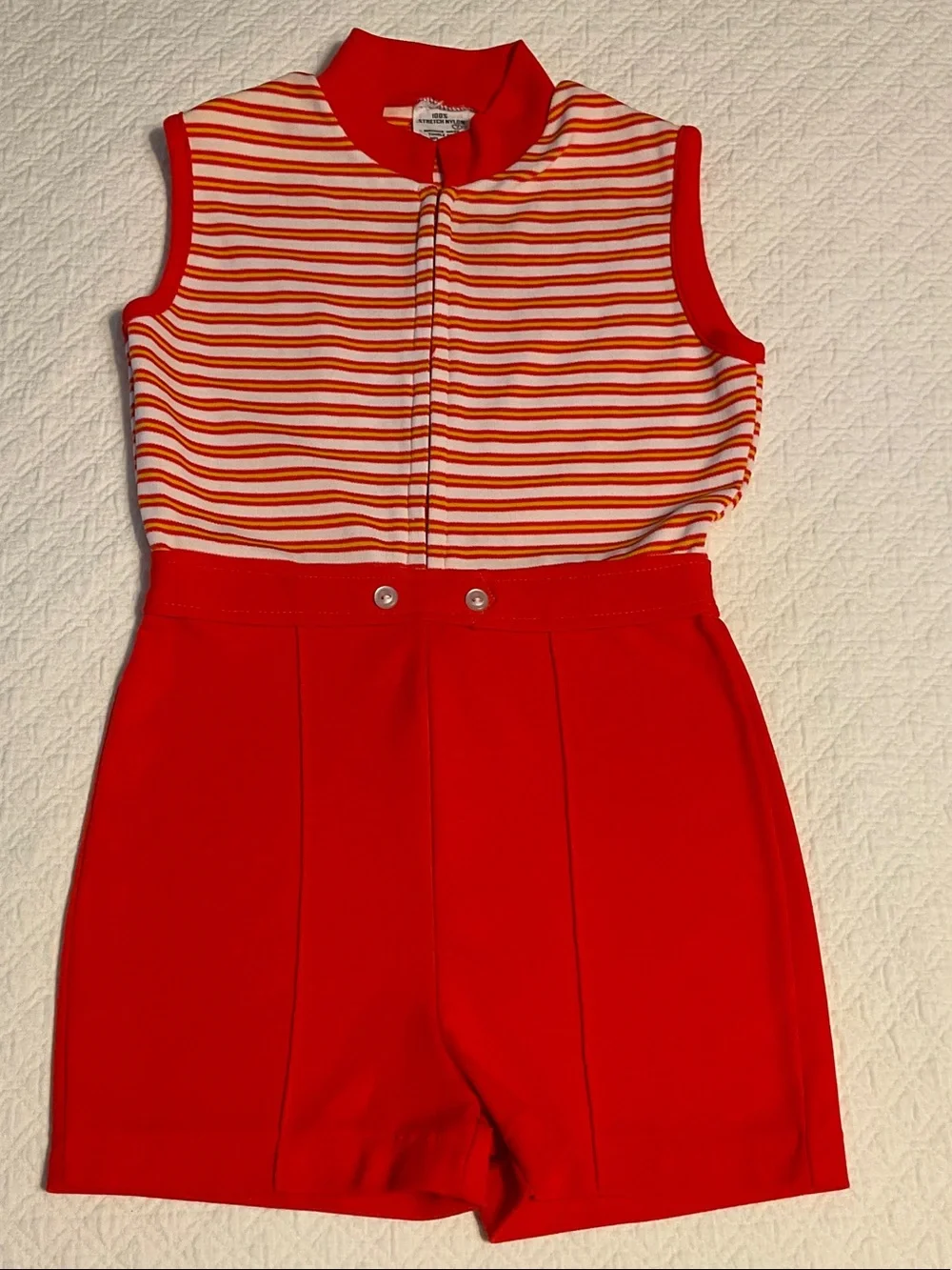 Vintage 1970s girl’s size 7 orange & white nylon knit romper with front zipper